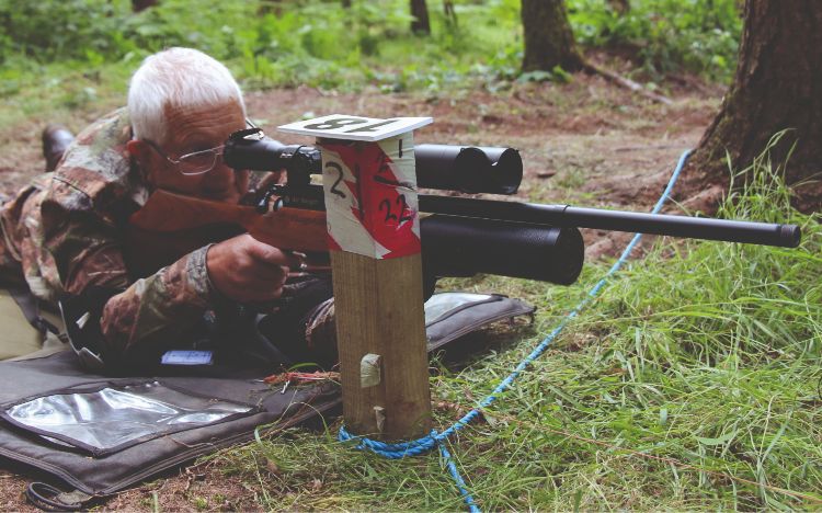 A man shooting an air rifle prone at an HFT event