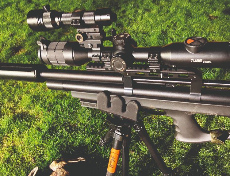 An air rifle topped with night vision scope