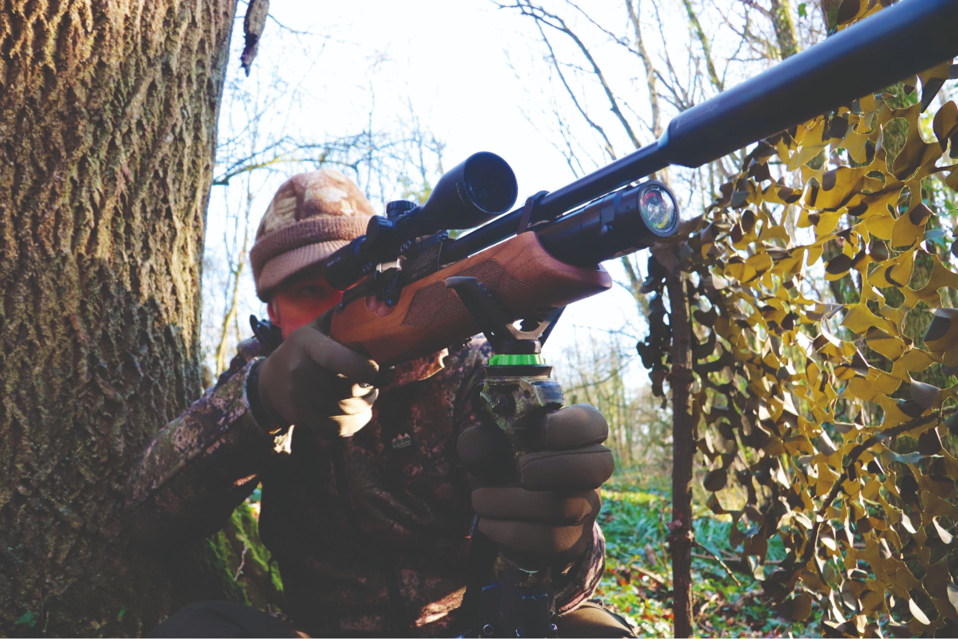 Mat Manning shooting his air rifle from a hide